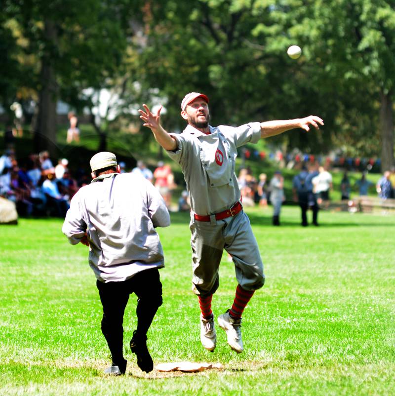 Ganymede shortstop Brett Rogers jumps up to try and catch a throw at second during Sunday, Aug. 13, 2023 action at the 20th Annual World Tournament of Historic Base Ball.