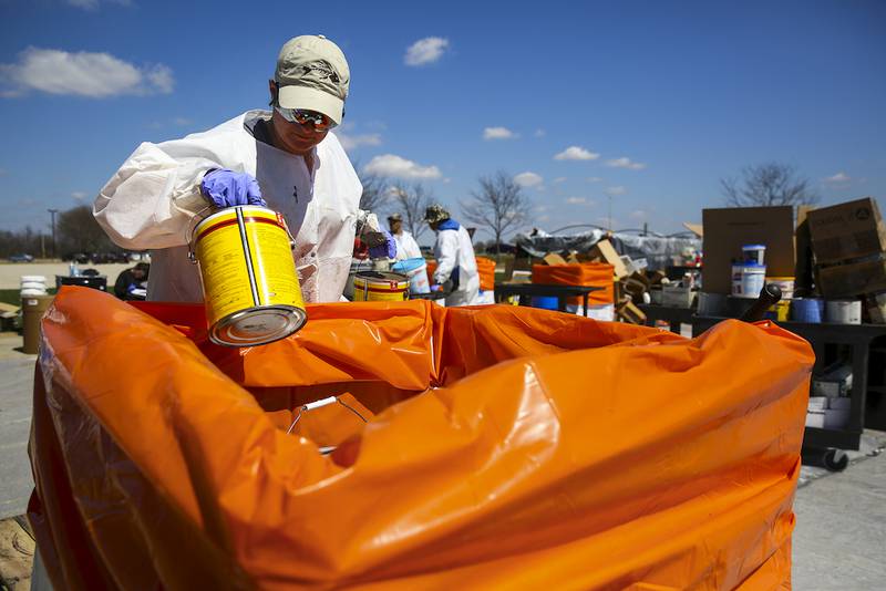 This file photo shows a can of oil-based paint being recycled during an event in Joliet.