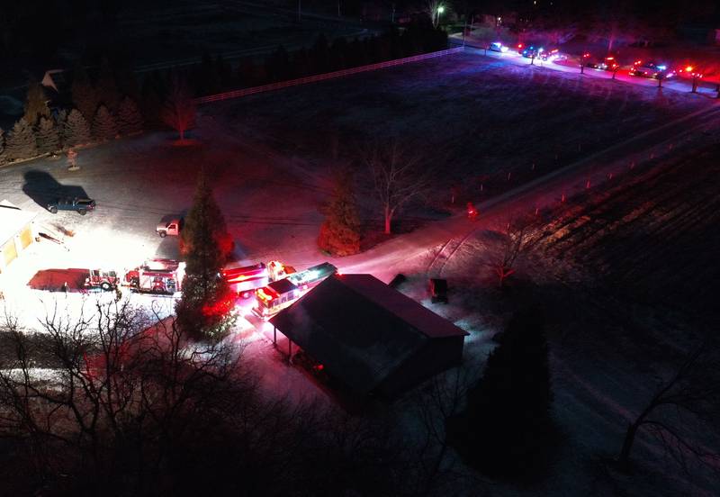 Fire crews stage at the scene of a structure fire in the 3000 block of East 550th Road on Saturday, Jan. 31, 2026 in Mendota. The fire started in the chimney area. Fire departments from Troy Grove, Utica, La Salle, Peru, Mendota, and others across the region were dispatched shortly after 10p.m.