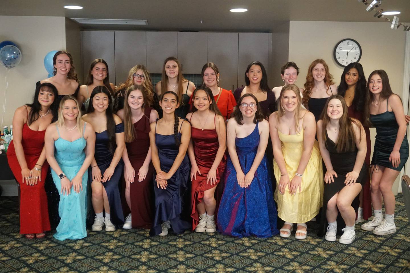 Rosary High School National Honor Society members participated in the 'senior' prom at GreenFields of Geneva. NHS President Jillian Ferraro of St. Charles, far left in front row, organized the event, held April 25, 2024 at the senior living facility.