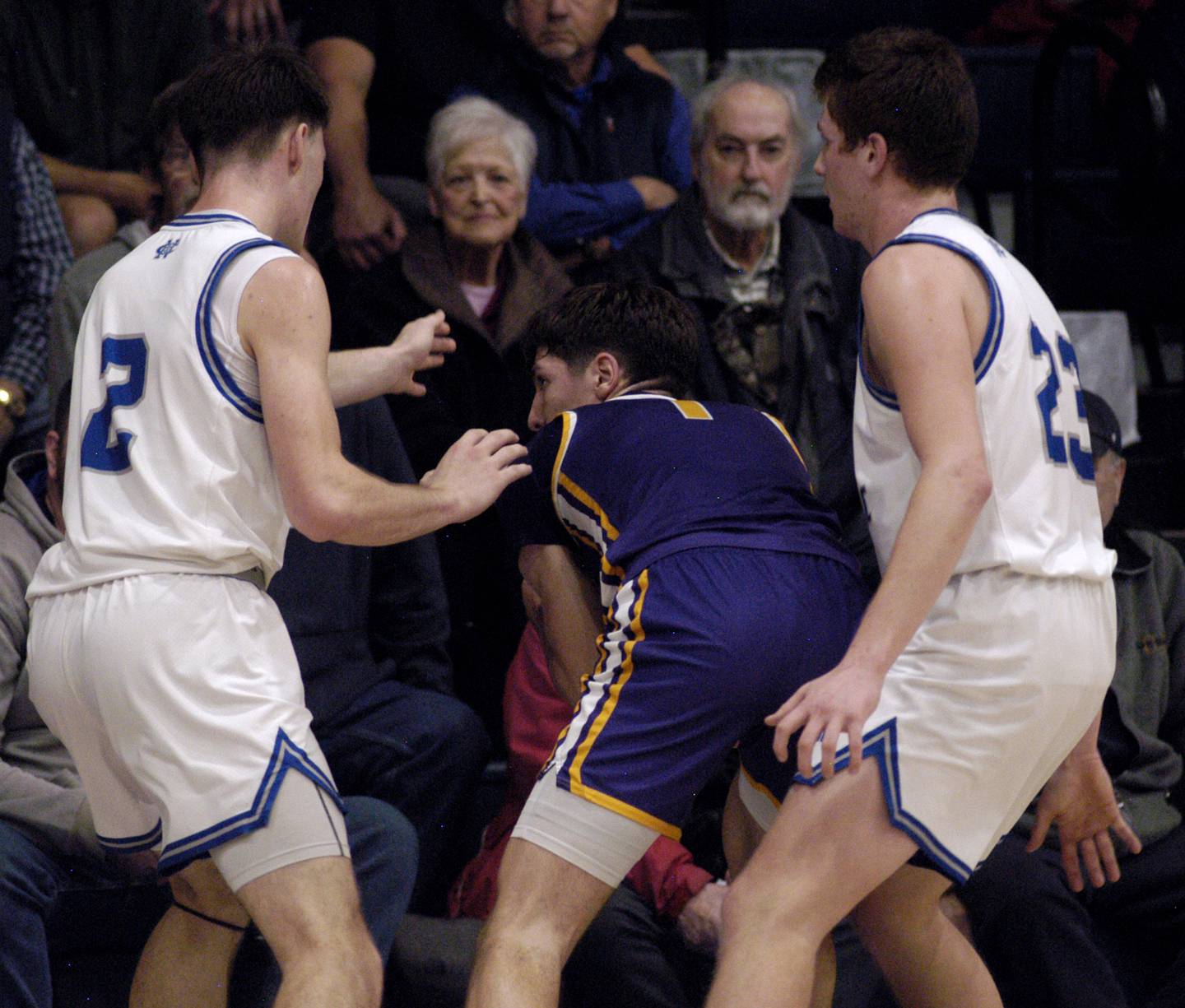 Newman's Asher Ernst and John Rowzee defend a Mendota player. The Newman Comets defeated the Mendota Trojans 67-66 at Newman High School in Sterling. The game took place on Tuesday, January 13, 2025.