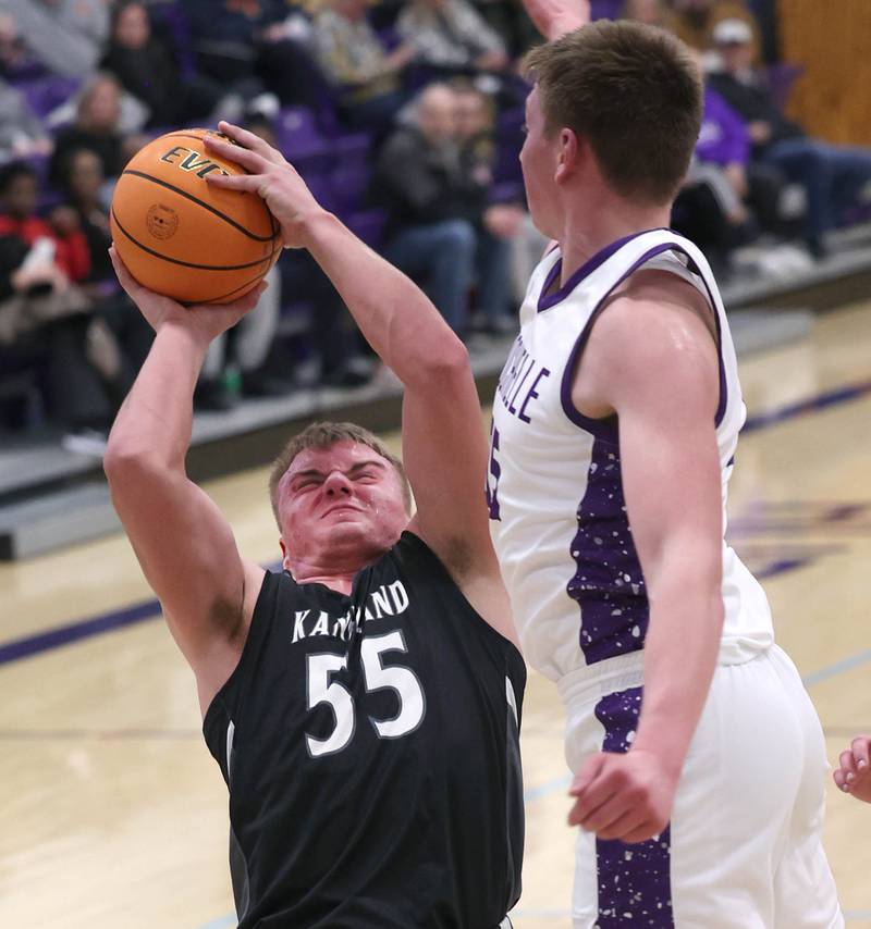 Kaneland's Jake Buckley tries shoot over Rochelle's Eli Schweitzer Tuesday, Feb. 3, 2026, in their game at Rochelle High School.