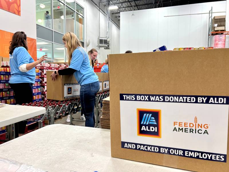 ALDI employees pack disaster relief boxes for Feeding America and the Northern Illinois Food Bank in Geneva, Illinois on May 9, 2023. Photo Credit: ALDI