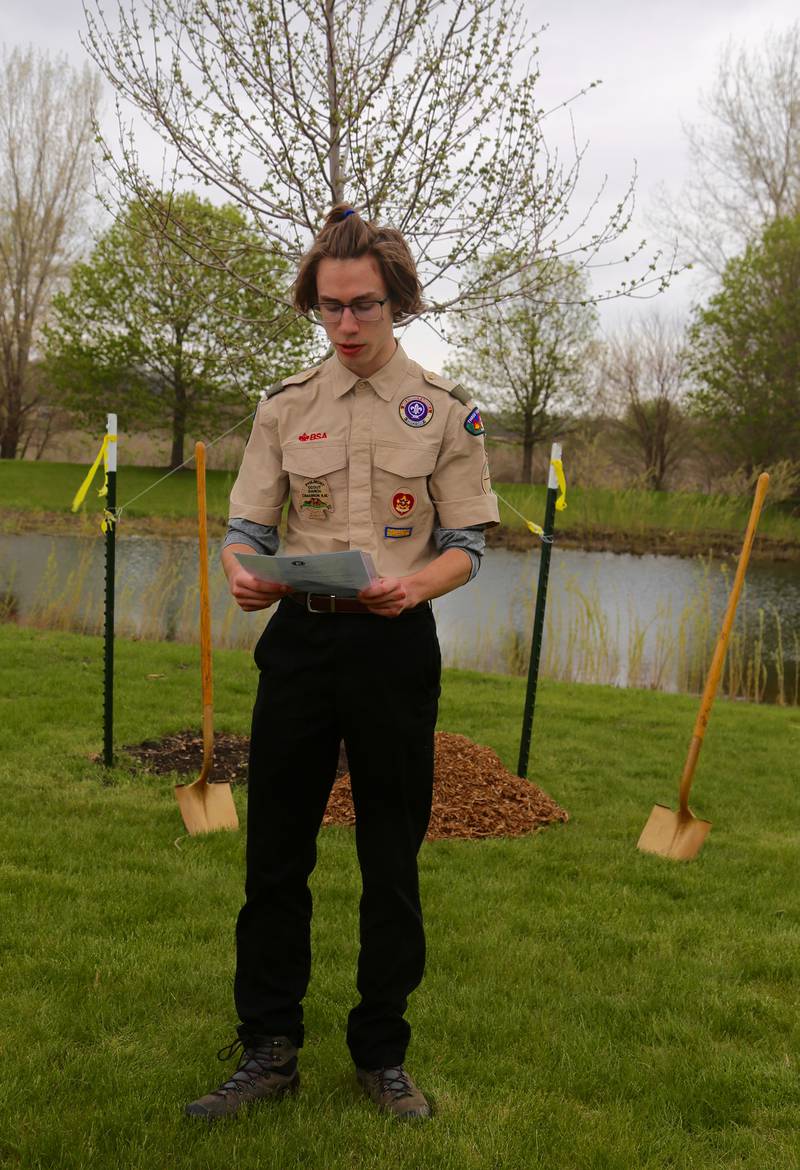 Boy Scout Logan Cashburn from Troop 7 reads a poem as part of an Arbor Day celebration on Saturday, April 27, 2024 at Oak Park in Elburn.