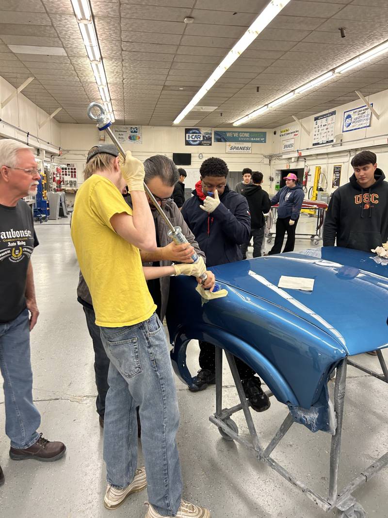 Waubonsee Community College students in the Automotive Training Center learn to use new dent-fixing equipment donated by Spanesi Americas Inc. The donation from Spanesi was valued at $25,000.