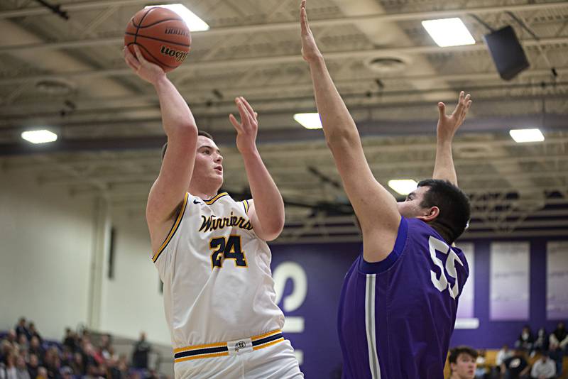 Sterling's Lucas Austin puts up a shot against Rochelle's Raul Aguirre in the regional finals Friday, Feb. 25, 20212.