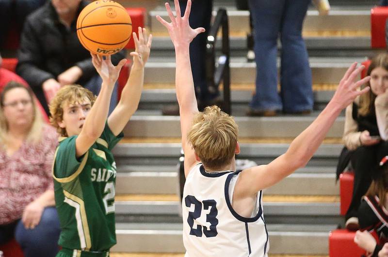 St. Bede's Kaden Nauman shoots a jump shot over Ridgeview's Carter Beck during the Route 17 Classic Tournament on Wednesday, Nov. 27, 2024 at Woodland High School.