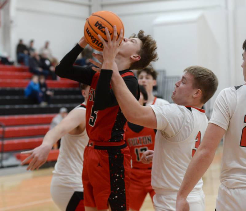 Fulton's Jacob Voss (5) shoots and draws contact from Amboy's Quinn Leffelman (34) on Friday,  Jan. 17, 2025 at Amboy High School.