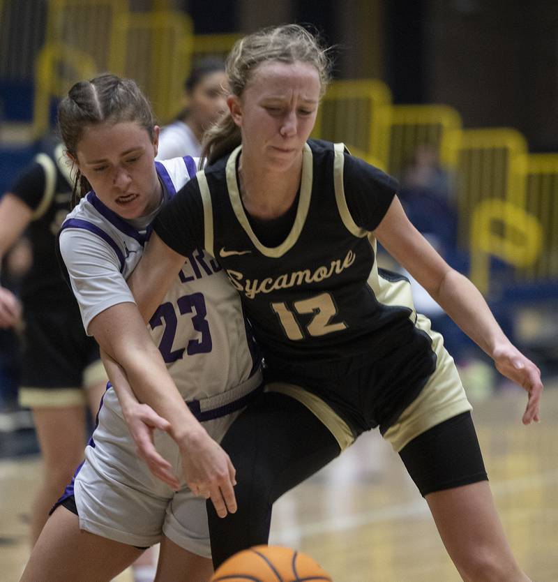 Plano’s Josie Larson and Sycamore’s Sadie Lang fight for a ball Monday, Feb. 17, 2025, during a 3A semifinal in Sterling.