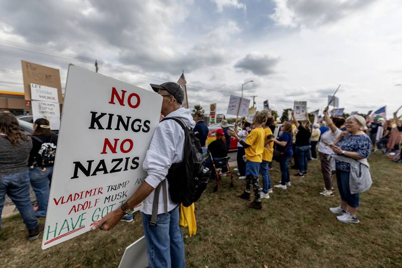 Protestors line Plainfield Road in Joliet during the No Kings Protest in Joliet on Oct. 18, 2025.