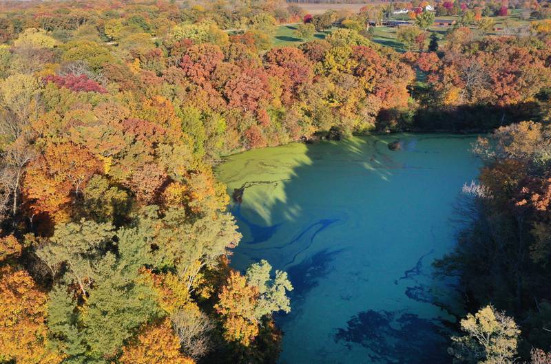 Fall colors shine brightly over Matthiessen Lake on Thursday, Oct. 24, 2024 at Matthiessen State Park.  Aerial photos were taken with permission through Matthiessen State Park.