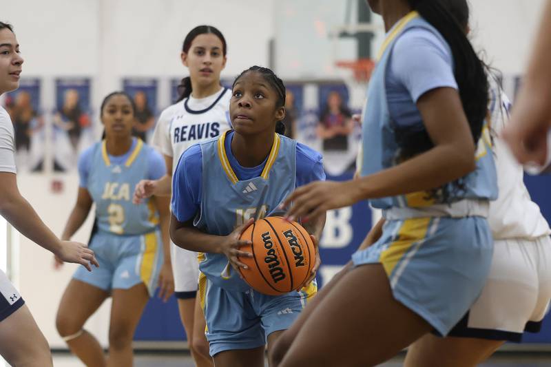 Joliet Catholic’s Laylah Carroll looks to take a shot from the paint against Reavis in the Peotone Blue Devils Holiday Classic championship game on Monday, Dec. 29, 2025 in Peotone.