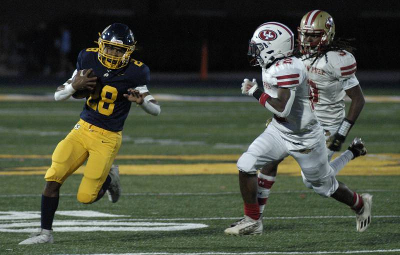 Sterling's Issac Ibarra sweeps around end. The Lions of Urban Prep traveled to Sterling to take on the Warriors at Prescott Memorial Field at Roscoe Eades Stadium, September 5, 2025.