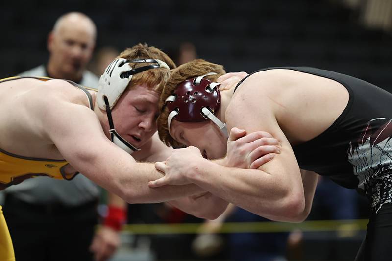 Lena-Winslow’s Oliver McPeek (left) and Marengo’s Owen Bills face off in the 215 pound first place match Saturday, Feb. 14, 2026, during the Class 1A wrestling sectionals in Byron.