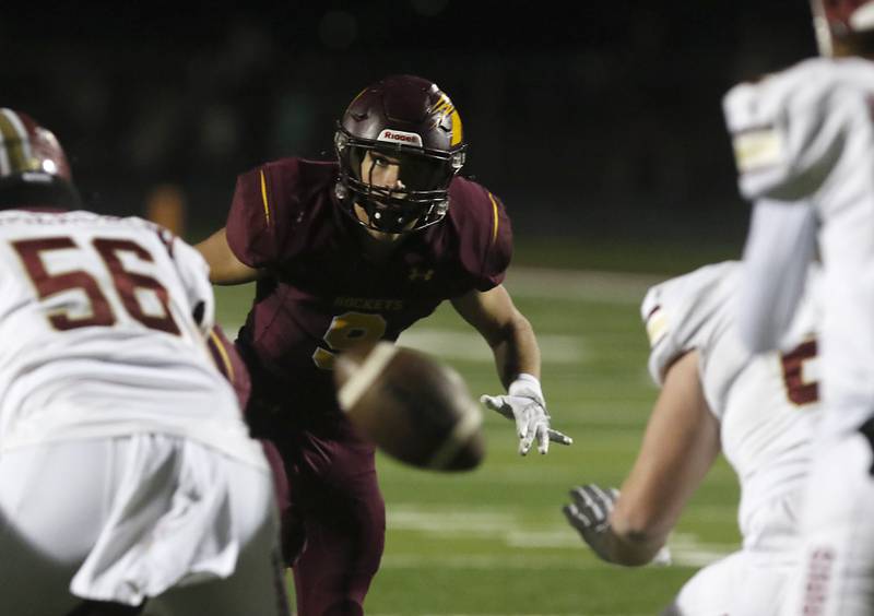 Richmond-Burton's Jack Martens rushes as the ball is snapped during a Kishwaukee River Conference / Interstate 8 Conference crossover football game Friday, Sept. 30, 2022, between Richmond-Burton and Morris at Richmond-Burton Community High School in Richmond.
