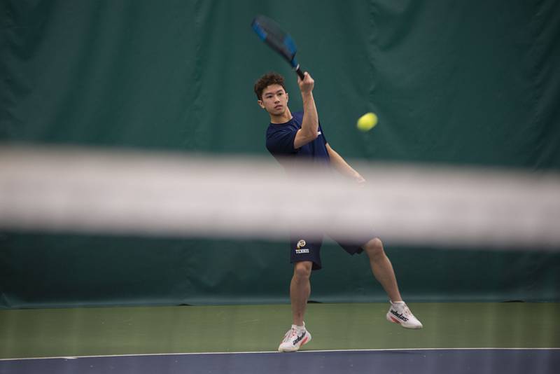 Sterling's Connor Pham returns a shot to Rock Island's Drew Jarding during a tennis meet at Westwood Thursday, March 31, 2022.