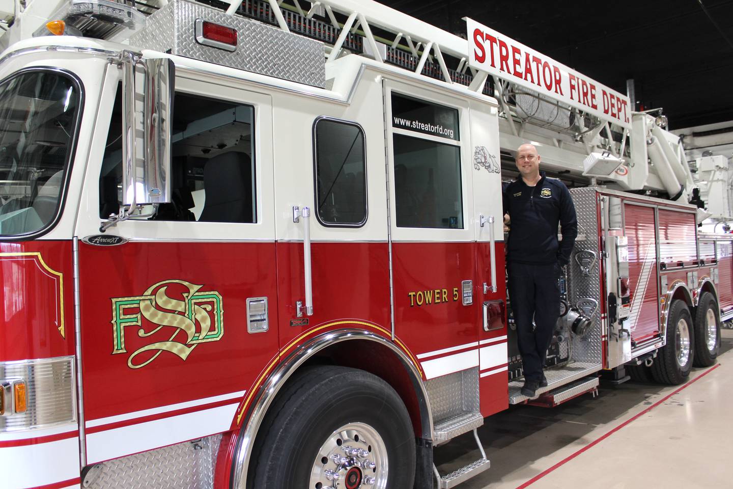 The Streator Bulldogs logo near Bryan Park's head in this photo is appropriate, as the Streator Fire Department lieutenant balances his first-responder responsibilities with an active role in Streator's sports community, including being a longtime assistant on the Streator High School boys varsity basketball team.