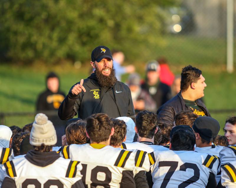 St Laurence head coach Adam Nissen addresses the team before Class 4A third round playoff football game between St Laurence at IC Catholic Prep.  Nov 11, 2023.