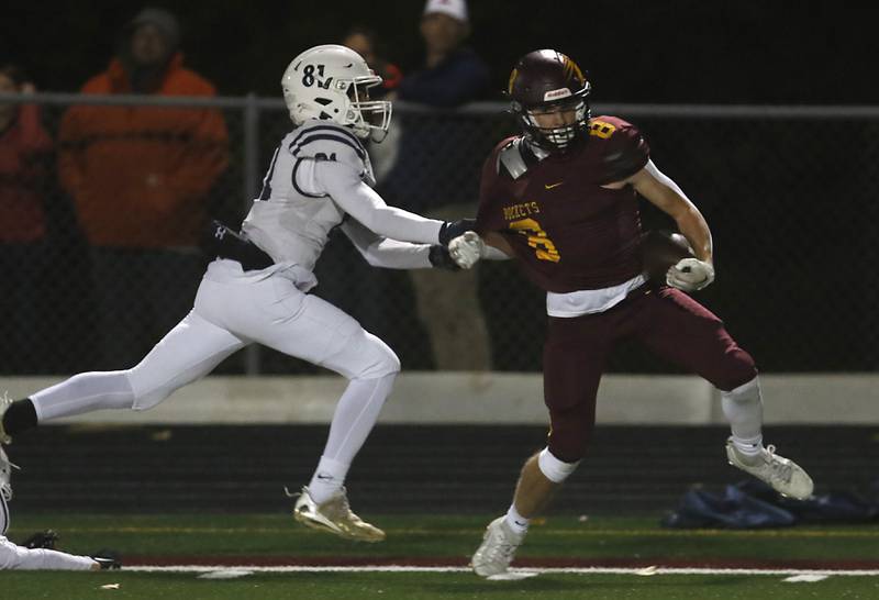 St. Viator's Jaylan Szlachetka makes forces Richmond-Burton's Jack Martens out of bounds after a long run during a IHSA Class 4A first round playoff football game Friday, Oct. 27, 2023, at Richmond-Burton High School in Richmond.