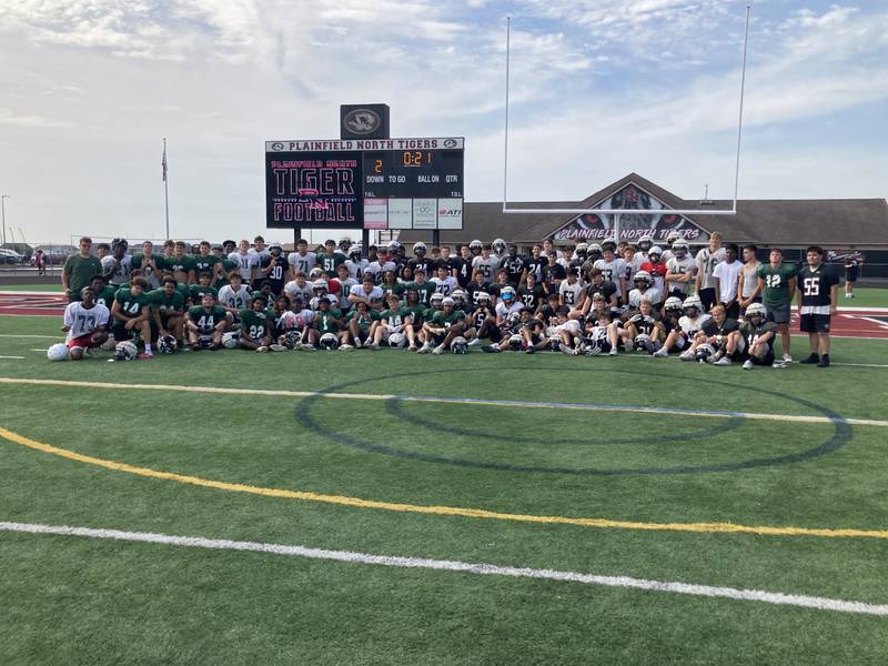 The Plainfield North and Waubonsie Valley football teams.