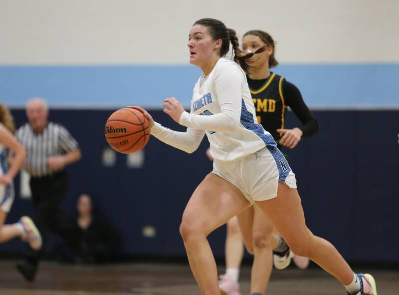 Nazareth's Danielle Scully (23) drives to the basket during the girls varsity basketball game between Fremd and Nazareth on Monday, Jan. 9, 2023 in La Grange Park, IL.