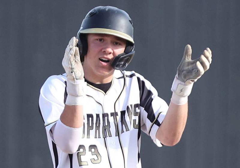 Sycamore's Kyle Hartmann applauds after hitting a double during their game against Morris Tuesday, May 9, 2023, at the Sycamore Community Sports Complex.