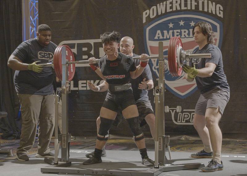 Andy Cabindol smiling after completing his final squat attempt of 425 pounds.