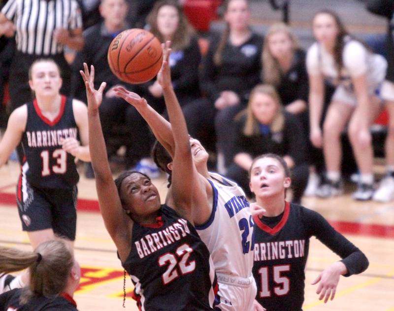 Barrington’s Adaobi Ibe (left) and Geneva’s Leah Palmer go up for a rebound during the Class 4A Schaumburg Supersectional on Monday, Feb. 27, 2023.