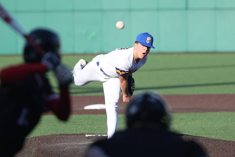 Joliet Central’s Rodney DeSilva delivers a pitch in relief against Aurora East on Monday, Mar. 11th in Joliet.