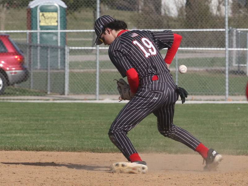 Hall's Noah Plym bobbles a ground ball against St. Bede on Monday, March 31, 2025 at Schweickert Stadium in Peru.
