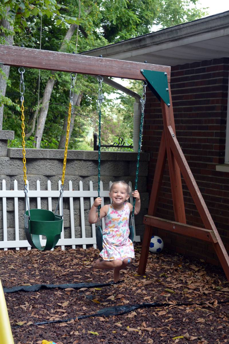 Aislynn Skinner, 4, of Oregon, swings in her backyard on Sept. 6, 2023. Aislynn, who was diagnosed with a critical congenital heart defect in utero, was selected as an American Heart Association Community Youth Heart Ambassador for the 2023-24 school year.