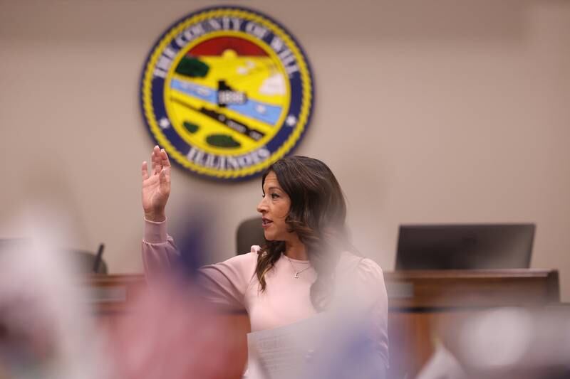 Will County Clerk Lauren Staley Ferry leads an oath before the counting of mail in ballots on Tuesday at the Will County Office Building.