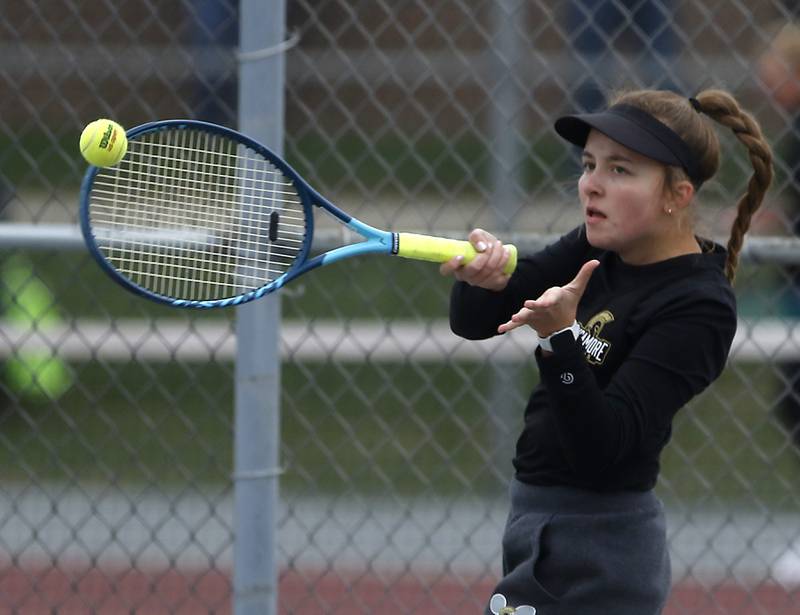 Sycamore’s Sabrina Ezell returns the ball Thursday, Oct. 20, 2022, during during the first day of the IHSA State Girls Tennis Tournament at Schaumburg High School in Schaumburg.