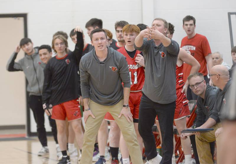 Forreston head coach Jake Groom (left) and assistant coach robert DeVries and the Cardinals' bench react to a call during action against Annawan at the championship of the 1A Amboy Regional on Friday, Feb. 28, 2025 at Amboy High School. DeVries has been named Forreston's head coach following the resignation of Groom.