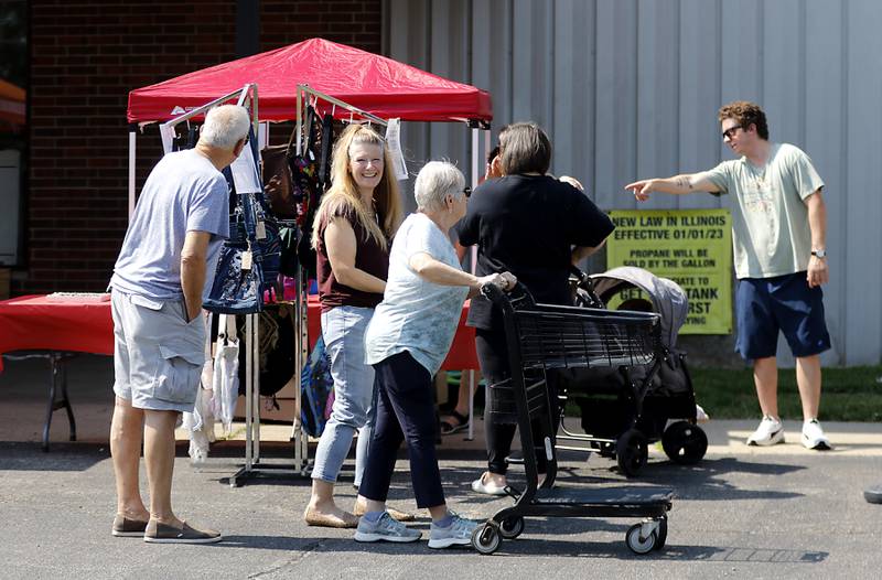 People shop at a Pop Up Market outside of the Laskowski ACE Hardware store, in McHenry, on Friday, Aug.15, 2025, during McHenry.’ 815 Day.