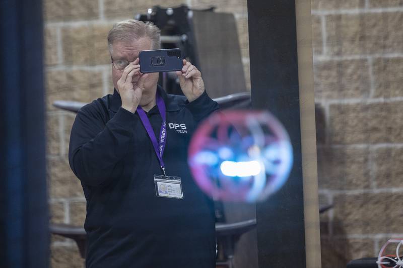 Jim Manley, Director of Tech for Dixon Public Schools, takes video Wednesday, Jan. 25, 2024 during the scrimmage. Because the district has two arenas, one at Reagan and one at the high school, DPS was chosen to host a district qualification tournament on Feb. 24.