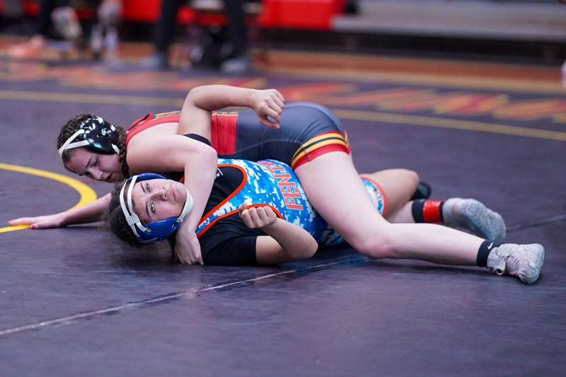 Batavia’s Sydney Perry (top) pins Fenton’s Yamile Penaloza to win the 145 pound championship in the Schaumburg Girls Wrestling Sectional at Schaumburg High School on Saturday, Feb 10, 2024.