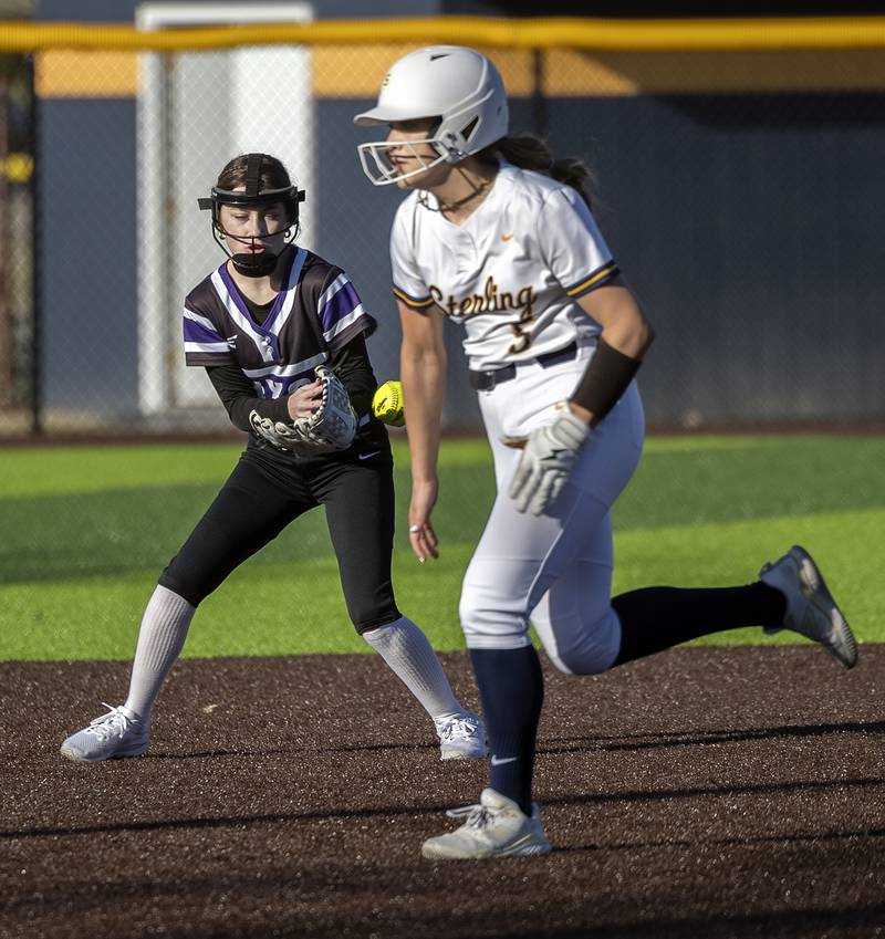 Dixon’s shortstop Addy Petty can’t put the squeeze on a ground ball against Sterling Tuesday, March 25, 2025.