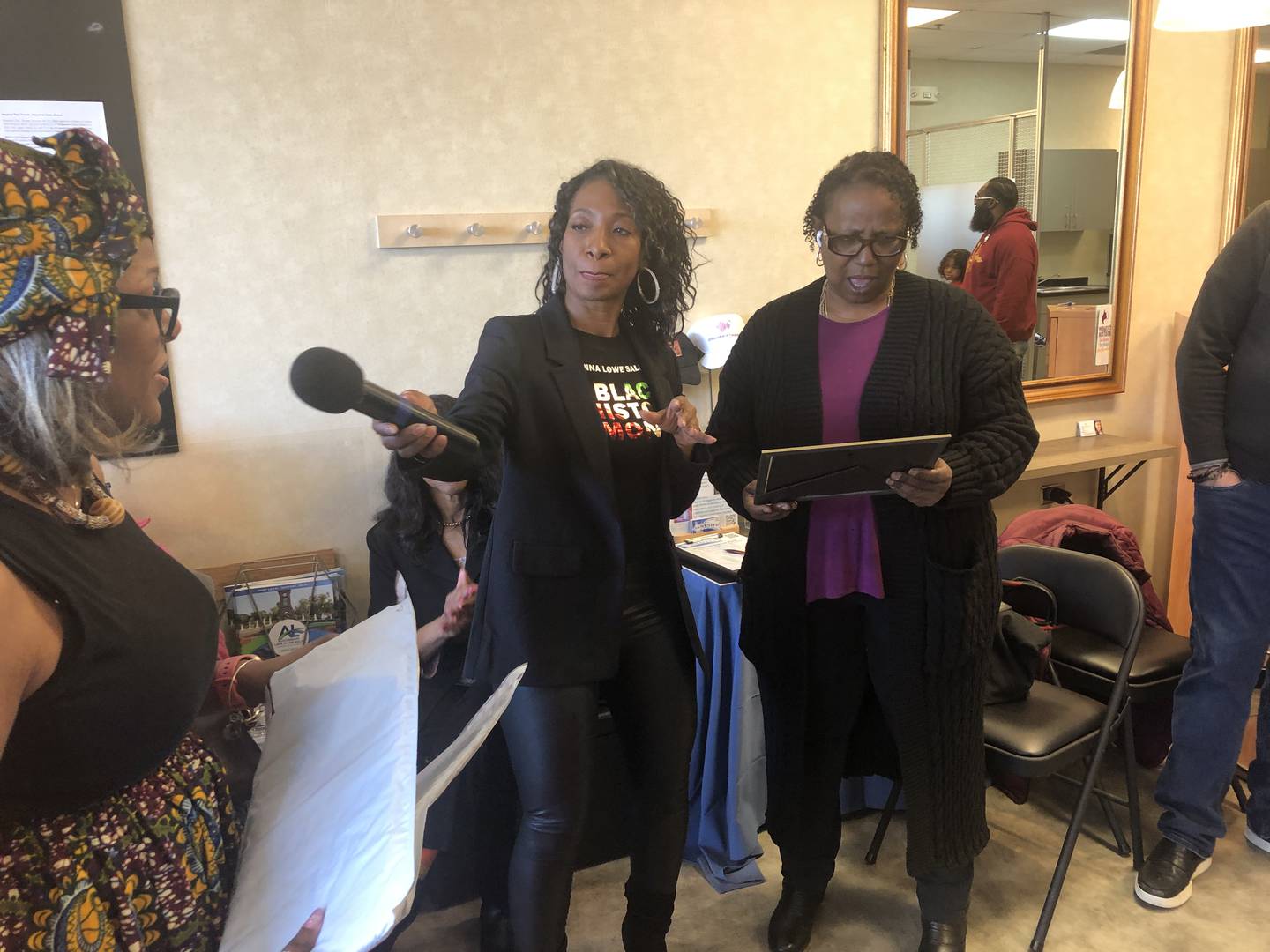 Emily Ferguson, left, presented Donna Lowe and Gloria Dillard with certificates recognizing their work as Black small business owners in McHenry County, during a Black History Month event Sunday, Feb. 25, 2024, in Algonquin.