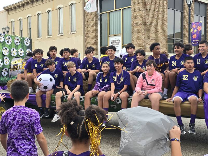 The Mendota High School soccer team rides Friday, Sept. 27, 2024, through the homecoming parade.