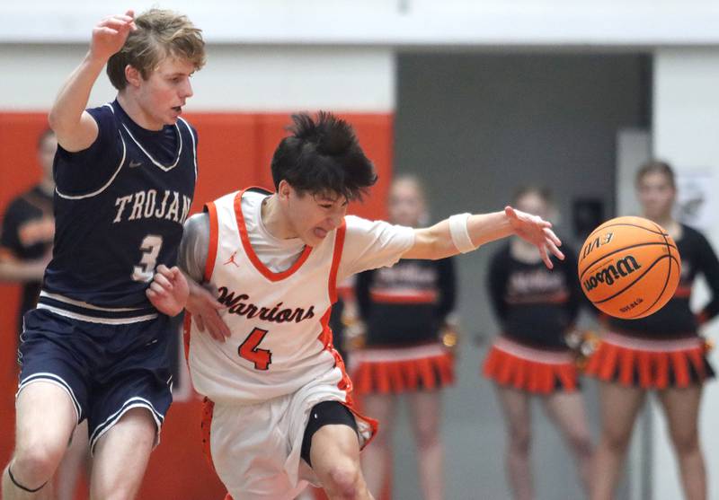 McHenry’s Cole Tapia, right, corrals the ball as Cary-Grove’s Connor Strike defends in varsity boys basketball on Tuesday, Feb. 17, 2026, at McHenry High School in McHenry.