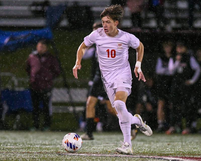 Benet Academy 's Jack Wesley (10) dribbles the ball up field while taking on Prairie Ridge during the class 2A super sectional soccer match on Tuesday Nov. 5, 2024, held at Wheaton Academy in West Chicago.