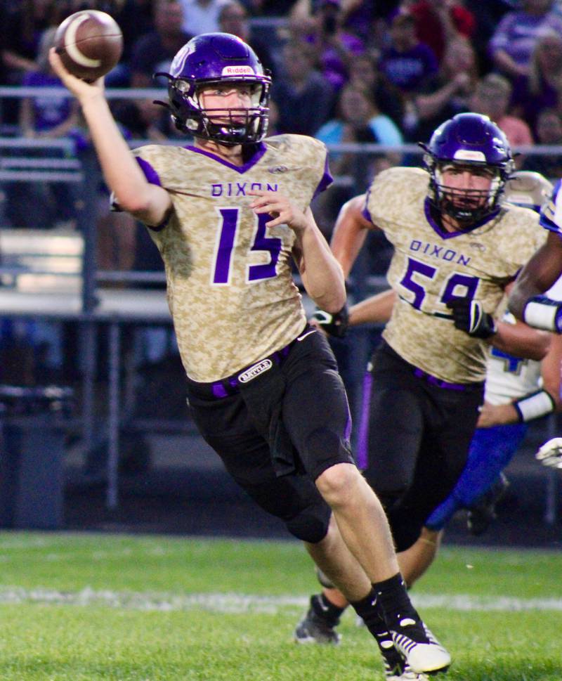 Dixon quarterback Tyler Shaner (15) rolls out on a pass play in the team's home opener on Friday.