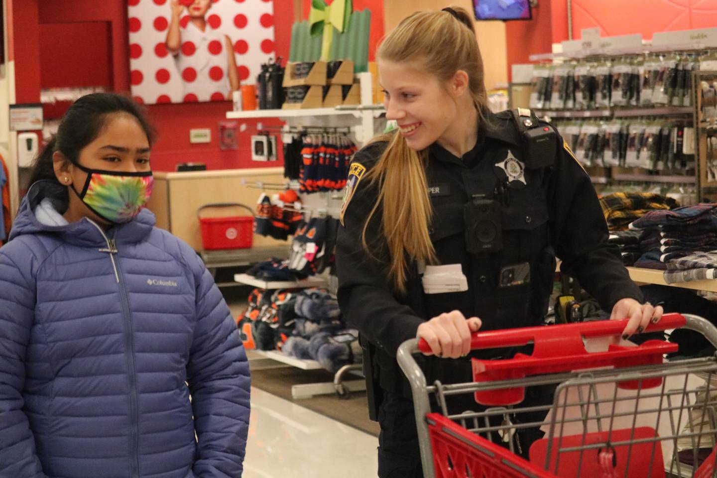 DeKalb resident Maci Serrano, 10, (left) shops with Officer Cooper as part of the "Heroes and Helpers" program put on by DeKalb police Sunday, Dec. 4, 2022.