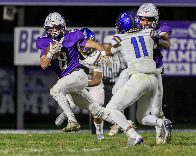 Wilmington's Kyle Farrell (8) runs behind the blocking of Braeden Anderson (1) during Class 2A semi-final playoff football game between Moroa-Forsyth at Wimington.  Nov 18, 2023.