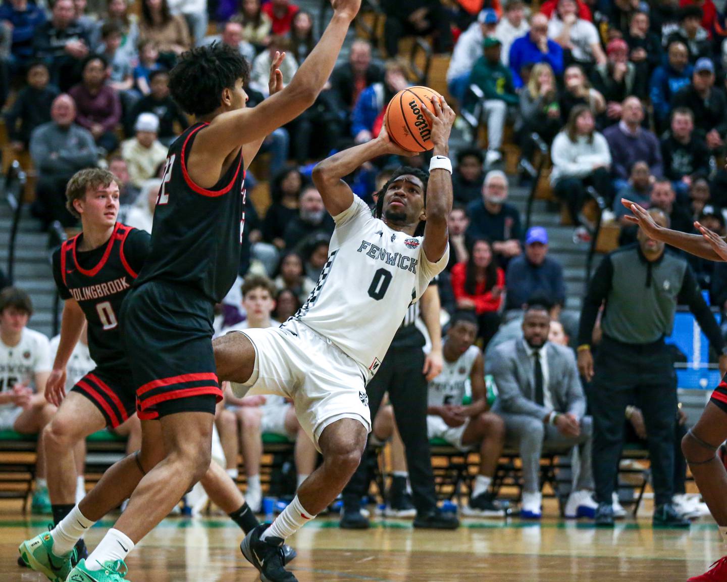 Fenwick's Dominick Ducree (0) shoots as he falls backwards during their Jack Tosh Holiday Classic basketball tournament Championship game between Fenwick at Bolingbrook. Tuesday Dec 31, 2024 in Elmhurst.