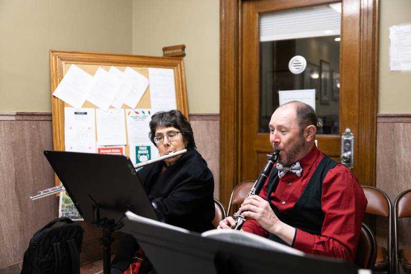 Barbara Saks, on flute, and David Vrablic, playing the clarinet, perform with the Salt Creek Chamber Orchestra during Christmas festivities in La Grange on Saturday, Dec. 3, 2022.