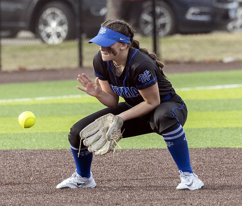 Newman’s Lucy Oetting fields a ball at shortstop against Sterling Tuesday, March 18, 2025.