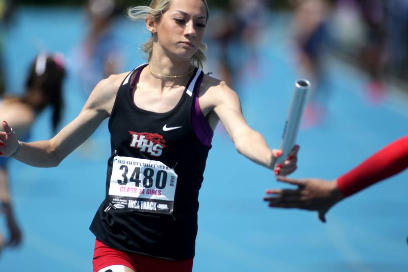 Huntley’s K’Leigh Saenz hands off the baton during the 3A 4x200-meter relay during the IHSA State Track and Field Finals at Eastern Illinois University in Charleston on Saturday, May 20, 2023.