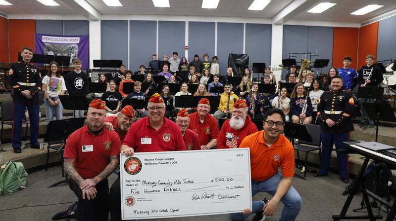 Members of the McHenry County Marine Corps League Detachment No. 1009 delivered a $500 check to the McHenry Community High School band program on April 3, 2025, in recognition of an ensemble from the band performing at last year’s McHenry County Marine Corps Ball.